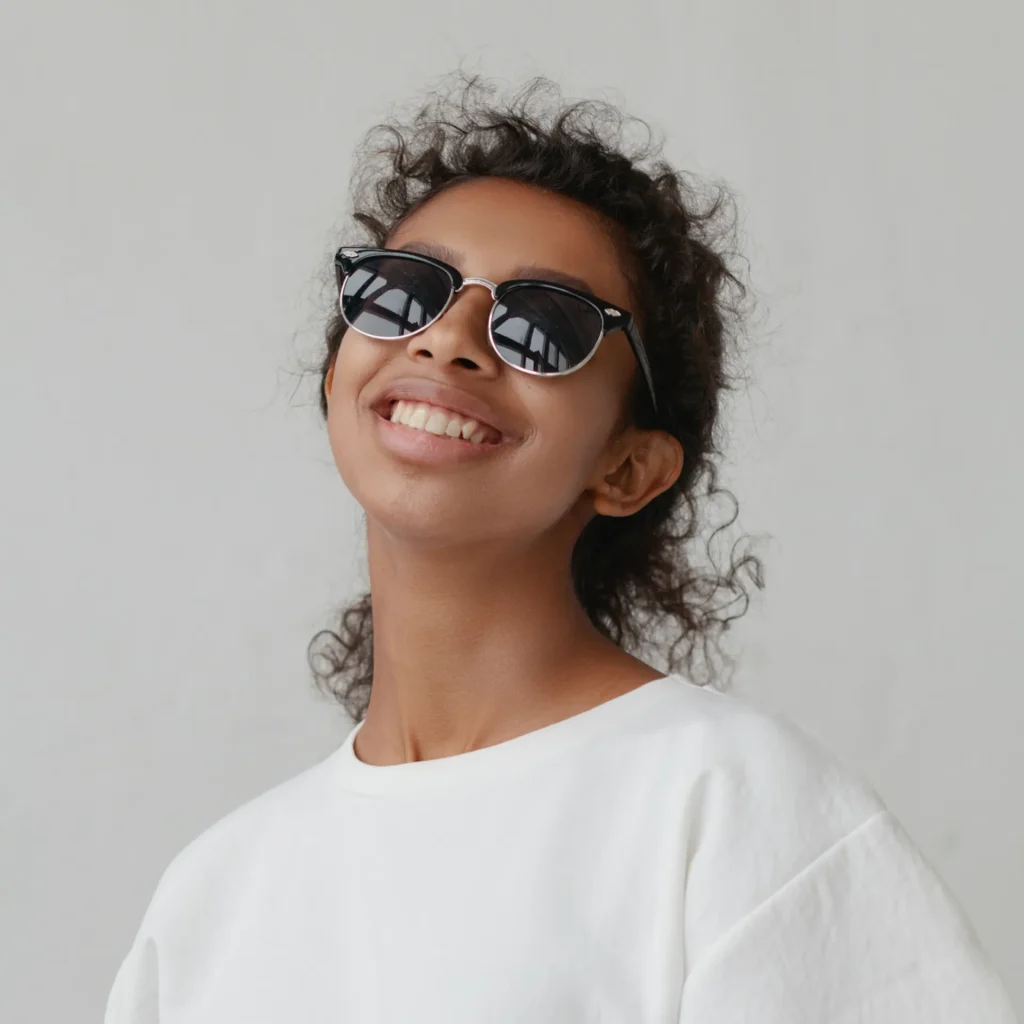 Female smiling with goodr sunglasses